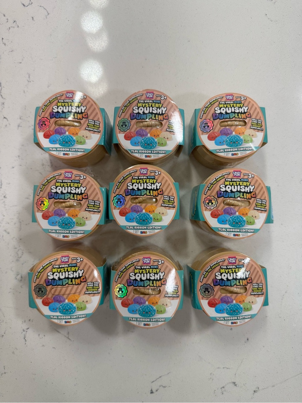 The viral MINI mystery squishy Dumpling teal ribbon edition Bundle ! Set of 9